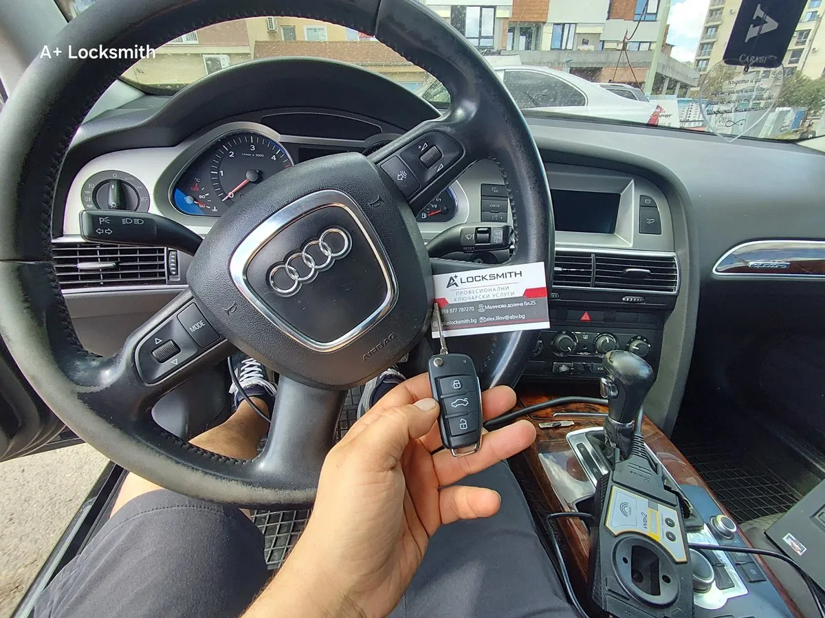 Audi A6: ключ и визитка на А+ на волана